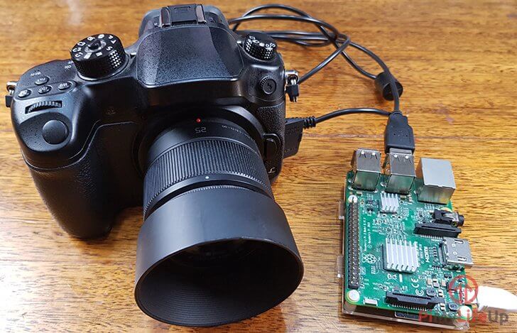 如何通过树莓派来控制数码相机拍摄照片？